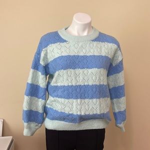 Baby blue and green sweater size L . Used brand cupcake